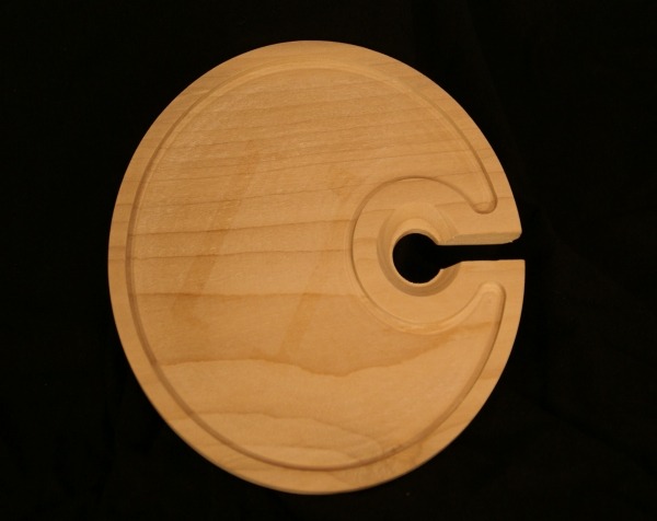 CNC-routed wooden plate with a precision-cut cup holder slot, available in bulk for manufacturers.